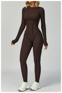 Detail of dark brown yoga jumpsuit featuring contrast stitching and ribbed texture fabric