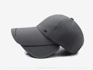 Side view of dark grey athletic sun hat featuring laser-cut vents and retractable brim flaps