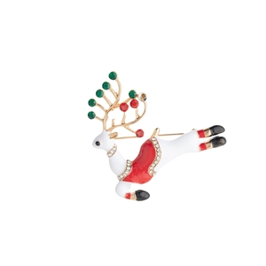 Close-up of white and red Christmas reindeer brooch with colorful crystal rhinestones