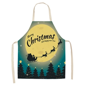 Detailed print showing Santa Claus and reindeer sleigh on green linen kitchen apron