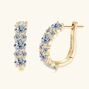 Detail view of gold-plated S925 sterling silver earrings with round moissanite engraving