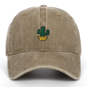Close-up of green cactus embroidery on vintage washed khaki cotton baseball cap