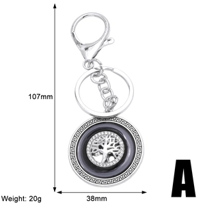 Detail view of tree of life keychain with crystal accents and dimensions 107x38mm