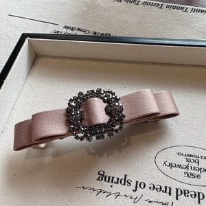 Elegant satin bow hair clip with sparkling crystal rhinestone round buckle for women.