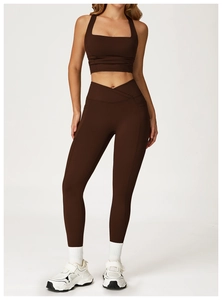 Close-up of high-waisted yoga leggings with V-cross waistband and side phone pockets