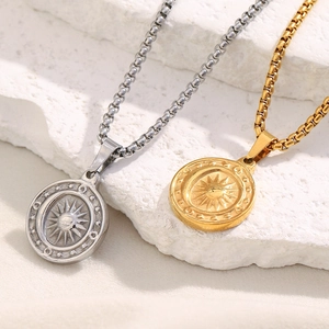 Detailed view of sun pendants in gold and silver finishes on elegant box chains