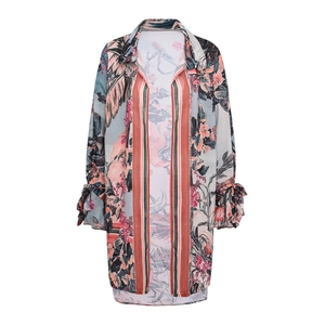 Detail of floral chiffon cover-up with retro print and tie-up bow cuffs for swimwear