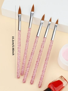 Vue détaillée de 5 pinceaux nail art avec manches rose pailleté et embouts marron précis
