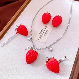 Exquisite red strawberry jewelry set with necklace, earrings, ring, and clip