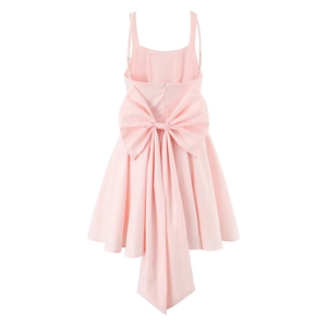 Detailed back view of a pink princess dress featuring a large decorative bow and A-line hem
