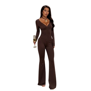 Slim fit dark brown long sleeve jumpsuit with deep V-neck and flared leg silhouette