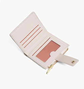 Pink short wallet interior detail with multi-card slots and transparent ID window