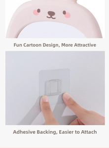 Detail of pink bunny mirror with strong adhesive backing for easy wall mounting