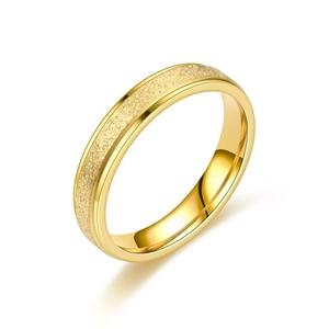 Polished gold clover ring featuring a matte sandblasted texture on a white background