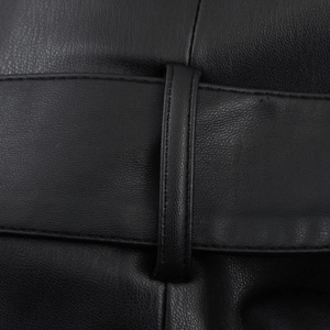Detailed macro shot of premium black leather texture and durable double-stitched seams