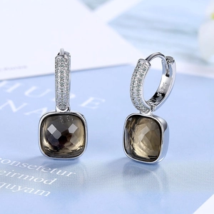 Macro shot of S925 silver square earrings with smoky quartz gemstone and pavé diamonds