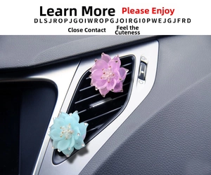 Close-up of purple and blue crystal lotus car air vent clips installed on car interior