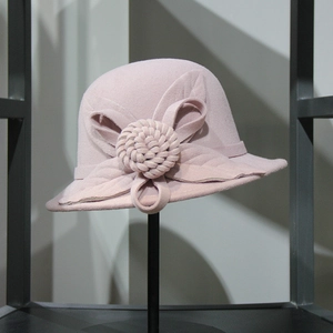 Detailed view of the pink wool felt cloche hat featuring an elegant 3D floral accent