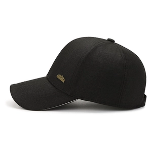 Black baseball cap for men featuring a mountain-shaped bronze metal badge detail