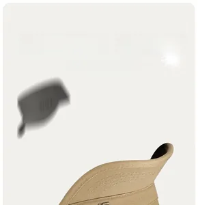 Detail view of khaki sun hat featuring fine woven fabric and premium metal logo emblem