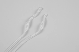 Detail of silk satin dress straps with precise stitching on a clean grey background