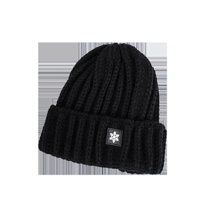 Classic black knitted beanie with snowflake patch and thick ribbed texture for winter warmth