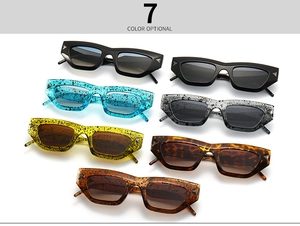 Detail view of cat eye sunglasses in various ink patterns and stylish tortoiseshell finishes