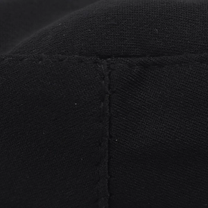 Macro detail of high-quality black knit fabric and precise stitching of the cosplay cap