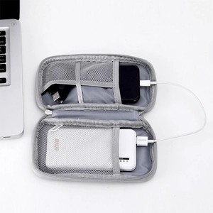Macro view of double-layer electronics organizer bag with mesh pockets and elastic straps