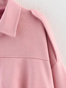 Detail of pink faux suede aviator jacket featuring lapel collar and shoulder epaulettes
