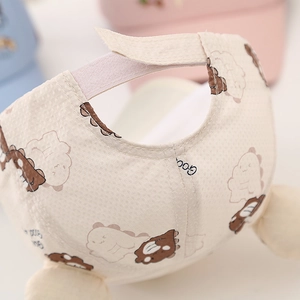 Detail of waffle fabric texture and adjustable velcro strap on cartoon baby baseball cap