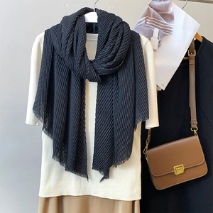 Solid black pleated cotton linen scarf styled with elegant vintage accessories and clothing