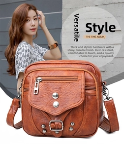 Vue détaillée du sac bandoulière vintage marron avec rivets métalliques et poches zippées