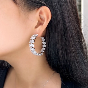 Silver S925 needle C-shaped hoop earrings featuring full white zircon pavé on model