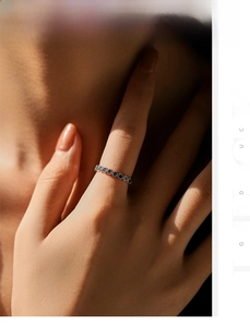 Detailed macro view of S925 sterling silver ring with navy blue and black round gems