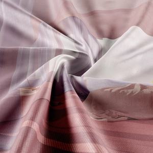 Detailed view of high-quality satin fabric with modern abstract pink and purple print