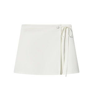 Modern white wrap mini skirt with waist tie and covered buttons on a clean white background