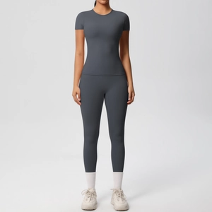 Front view of charcoal grey high-stretch yoga set with t-shirt and high waist leggings