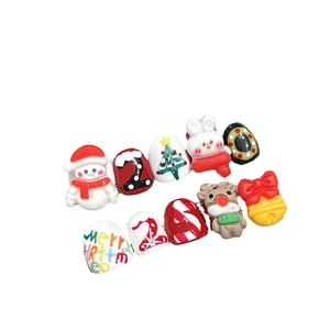 Handmade 3D Christmas press-on nails featuring snowman, reindeer and tree designs