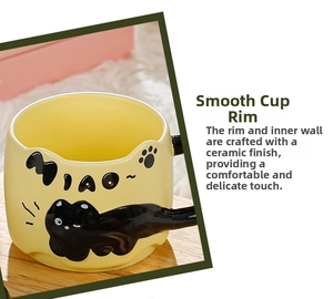 Close-up of the smooth wave-shaped cat ear rim on the yellow ceramic coffee mug