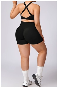 Rear view of black high-waisted compression yoga shorts and sports bra set for women