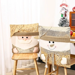 Detail of Christmas chair covers featuring Santa and Snowman with gold sequins and plush fabric