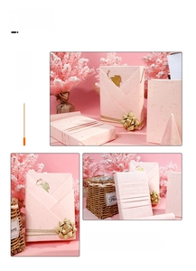 Pink gift wrapping paper with gold glitter stars and matching decorative silk ribbon
