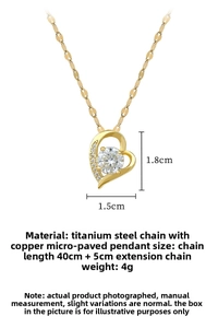 Macro detail of gold hollow heart pendant with large zircon and micro-pave crystals