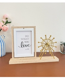 Close-up of a rotating Ferris wheel photo frame with a 4x6 inch double-sided design