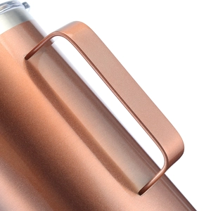 Detail of ergonomic handle connection on rose gold vacuum insulated stainless steel mug