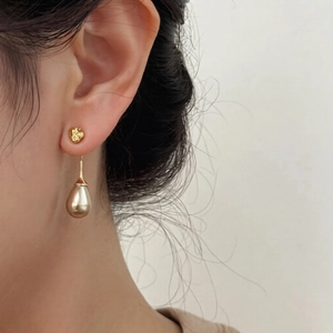 Elegant French vintage gold drop earrings featuring a textured pear shape for women