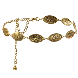 Vintage golden waist chain belt with carved oval turquoise elements on white background