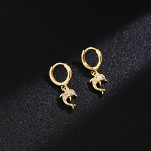 Detailed view of gold dolphin hoop earrings with sparkling micro-inlaid rhinestones