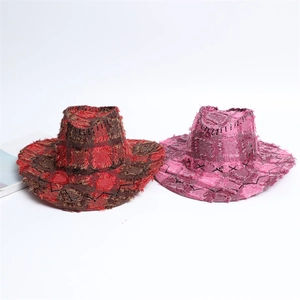 Detail of plaid western cowboy hats with distressed frayed edges and thick stitching decor